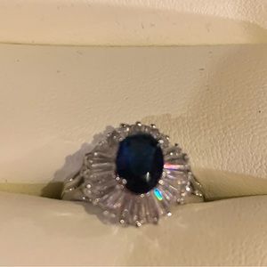 Simulated, sapphire, and diamond in a ring